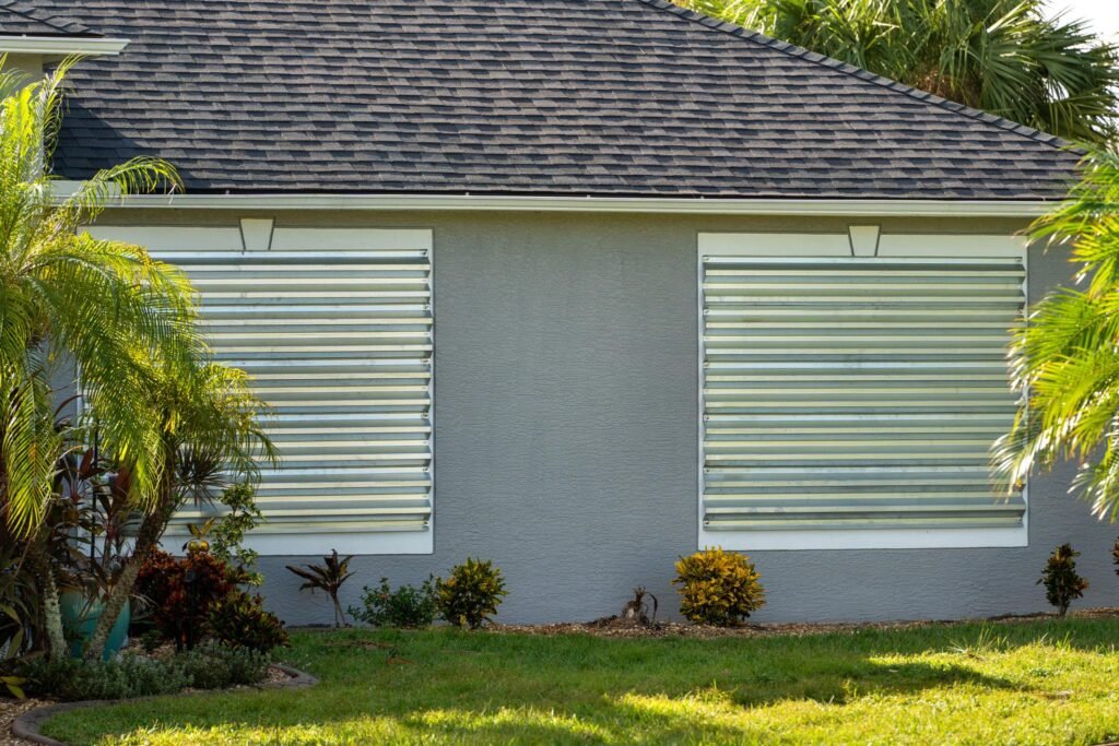 a Florida home with storm shutters secured and its exterior prepared for severe weather.